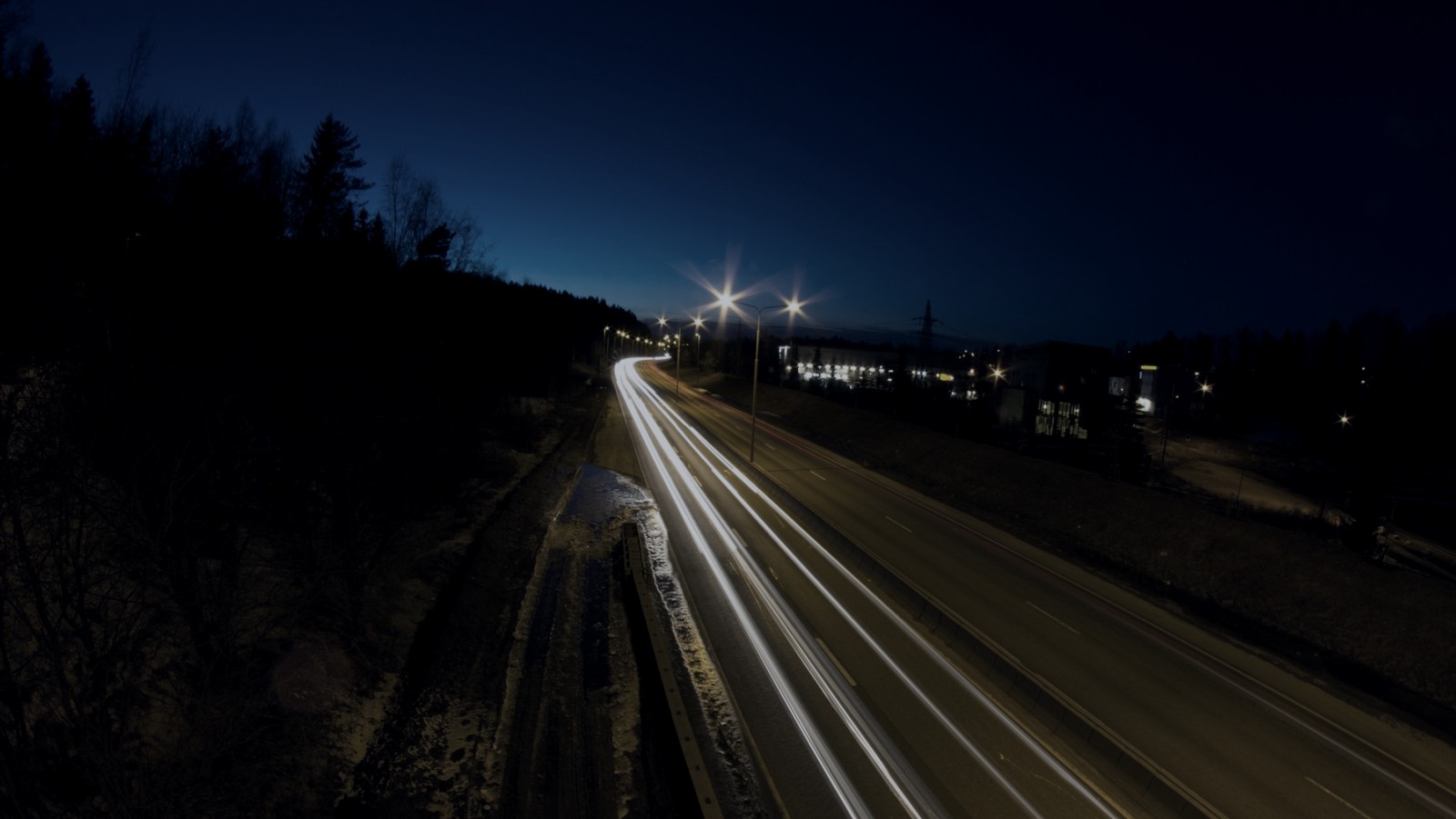 Lights trails along a darken road