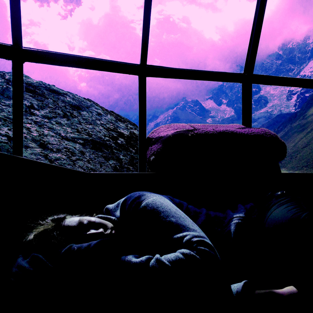 Sleeping in front of a large window with the world behind